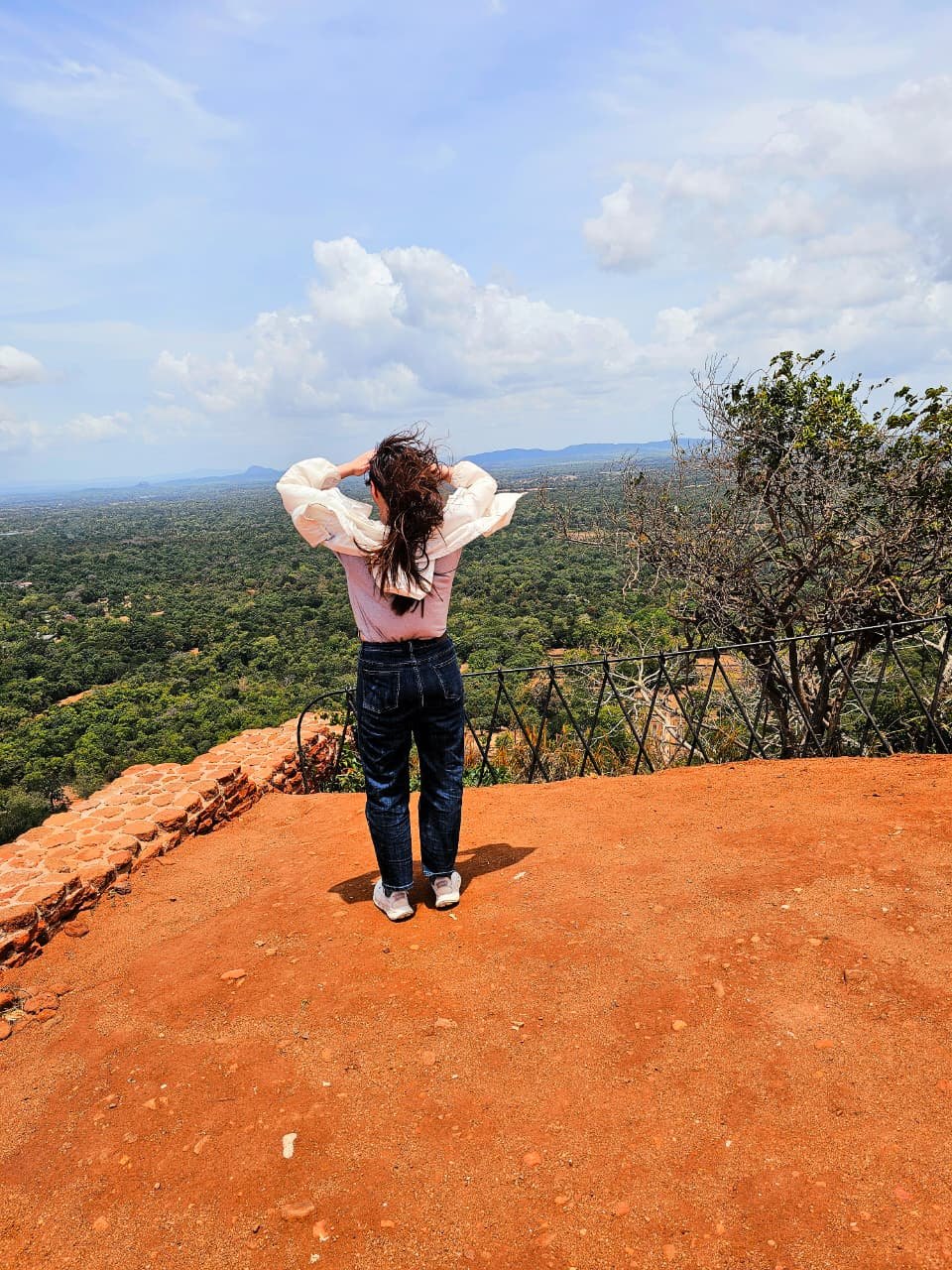 A visitor exploring the Sigiriya landscape
